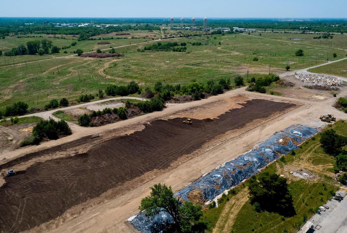 Panasonic plans to build a $4 billion, 4,000-employee factory at the former Sunflower Ammunition plant in De Soto to make batteries for the rapidly growing electric vehicle market. On Wednesday afternoon, crews were cleaning up an area where administrative offices once stood. The four water towers and plant are at top.