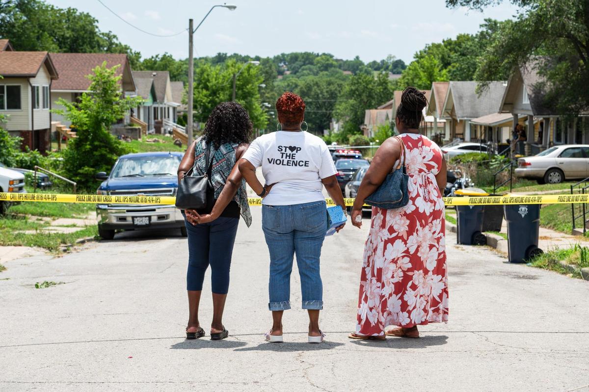 Founder and director of Kansas City Mothers in Charge, Rosilyn Temple, middle, looks over the scene of a fatal shooting that left one person dead on the 4500 block of South Benton Avenue on Wednesday, July 12, 2023, in Kansas City. Police have taken one person of interest into custody.