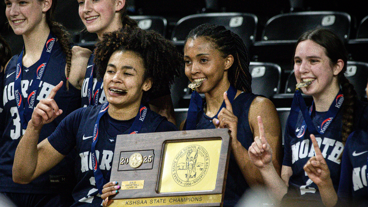 Jaliya Davis (left) and Aubrey Shaw (middle) celebrate with teammates after Blue Valley North won its second Kansas Class 6A state title in three seasons on Saturday, March 15, 2025.