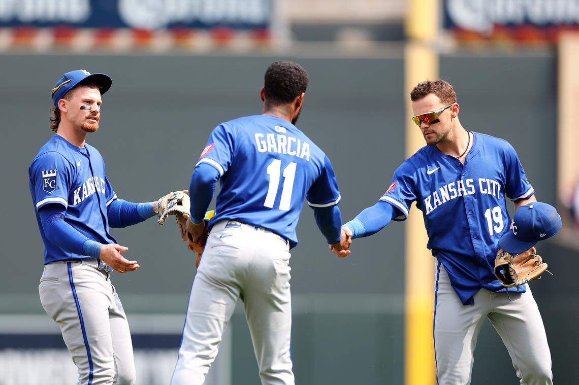 Royals infielders Bobby Witt Jr., from left, Maikel Garcia and Michael Massey celebrate a win against the Minnesota Twins at Target Field in Minneapolis on May 25, 2025.