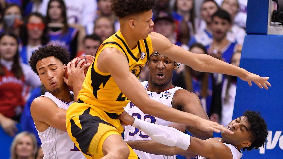 Ku’s Jalen Wilson, leftl pulled down a rebound over MU’s Trevon Brazile during the second half of Saturday’s game at Allen Fieldhouse. KU beat Missouri, 102-65.