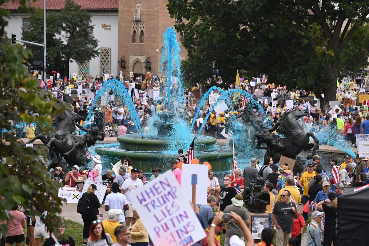 Demonstrators rally Saturday at Mill Creek Park in Kansas City as part of nationwide “No Kings” protests against the Trump administration.