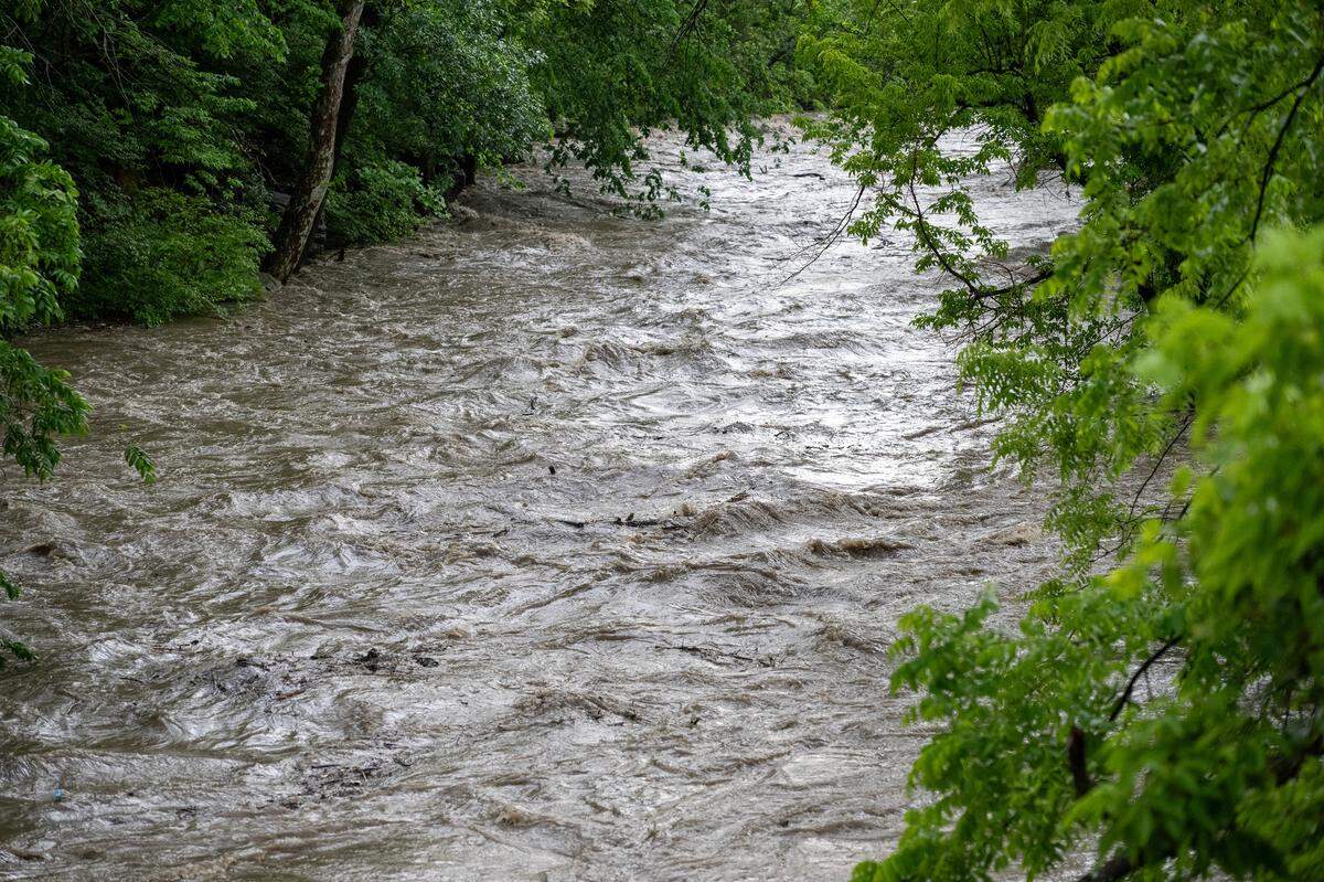 Indian Creek was bank-full at State Line Road near 103rd Street Monday, May 19, 2025, after strong storms dumped heavy rain on the Kansas City metro area.