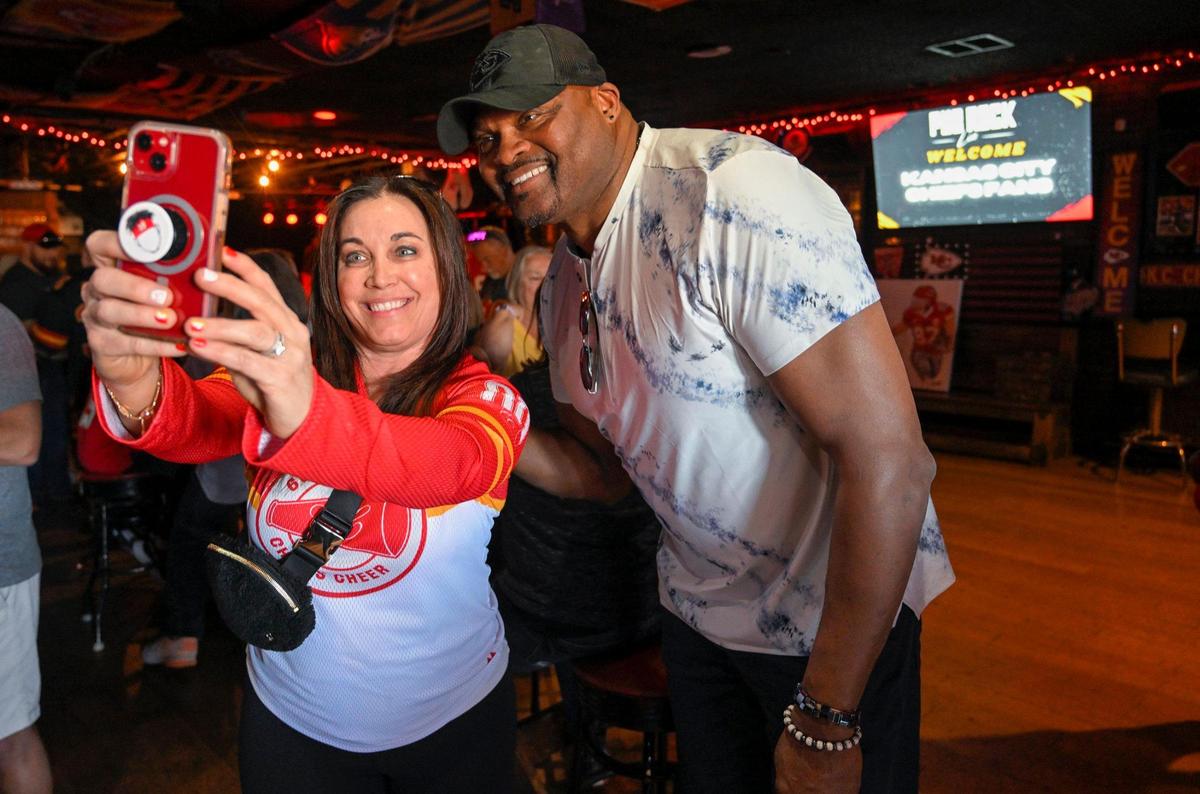 Natalie White, a former Kansas City Chiefs cheerleader, took a selfie with Neil Smith, a former Chiefs defensive end, on Wednesday, Feb. 8, 2023 at Pub Rock Live, a Chief’s bar in Scottsdale, Arizona. White was 17-years-old when she cheered for the Chiefs. White now lives in Las Vegas and traveled Arizona for Super Bowl LVII.