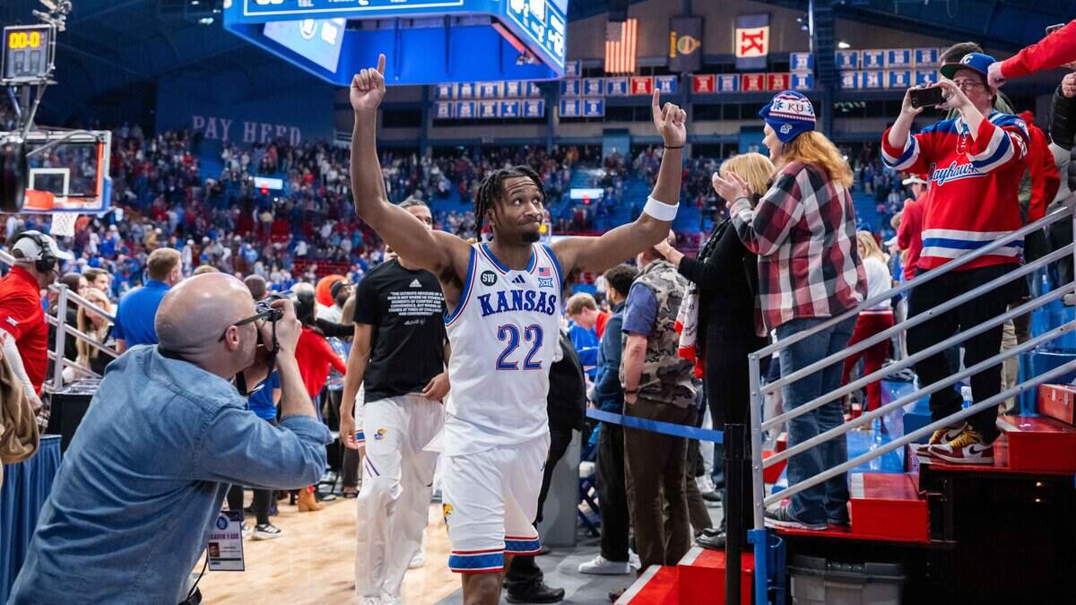 Kansas Jayhawks guard Darryn Peterson points to the sky as he exits the floor following KU’s 80-62 college basketball victory over the visiting Baylor Bears at Allen Fieldhouse in Lawrence, Kansas, on Friday, Jan. 16, 2026.