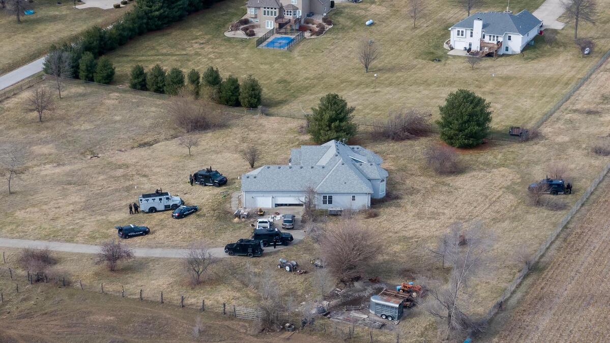 Tactical police vehicles remain outside of the house at 1111 N. Else Smith Road where a suspect opened fire on police and a civil process server on Thursday, Feb. 29, 2024, in Independence.