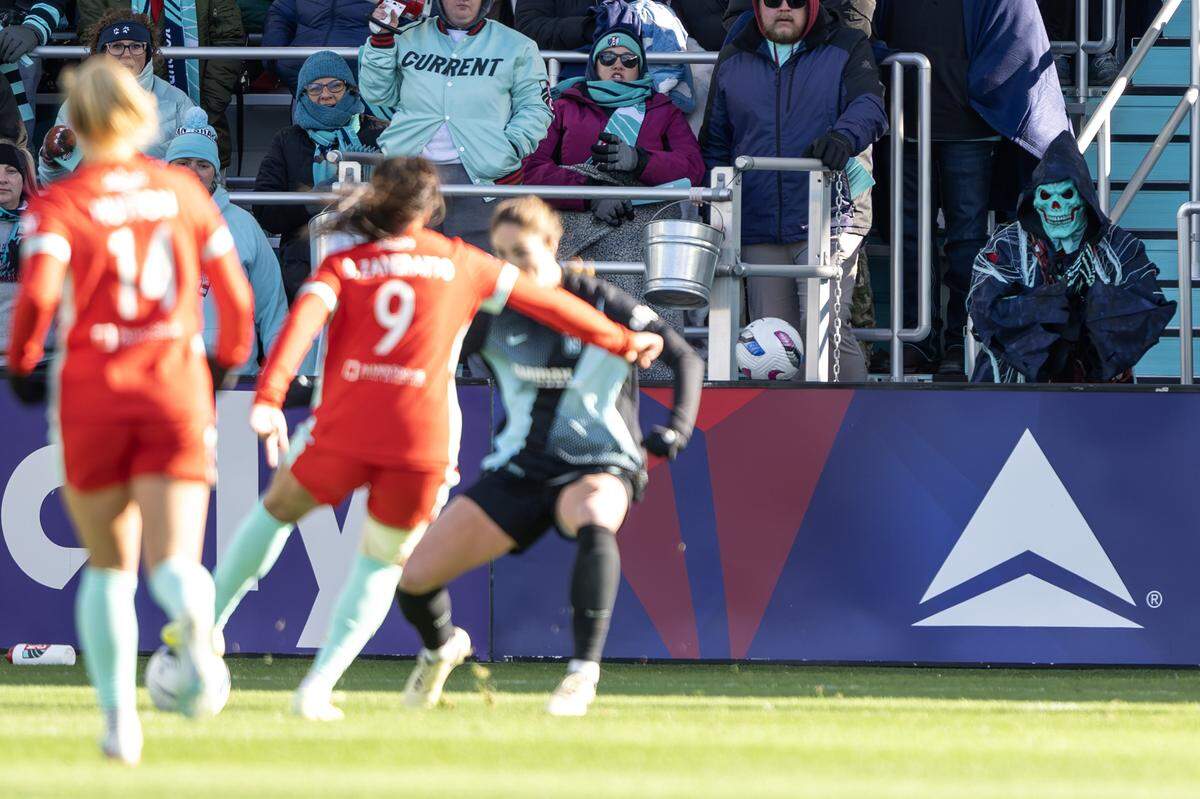 A KC Current fan dressed as a teal skeleton watches from the stands during an NWSL quarterfinal playoff match at CPKC Stadium in Kansas City on Sunday, Nov. 9, 2025.