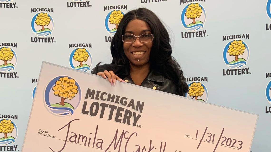 Jamila McCaskill, 44, with her $100,000 check.