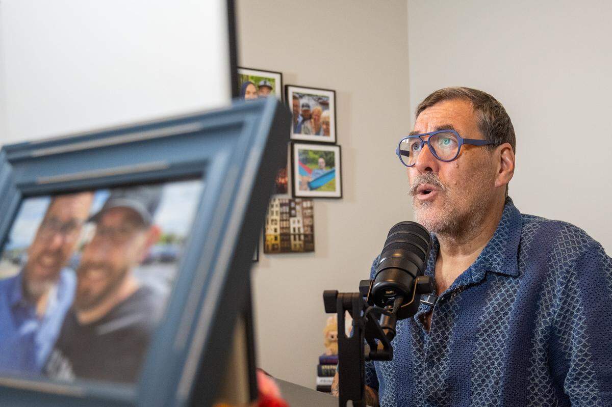 Kris Saim reads thru lines for his podcast, Dying Out Loud, at his home on Friday, April 10, in Kansas City. Saim has Stage 4 terminal cancer and is recording a podcast that talks about death and features him having conversations with friends and family.