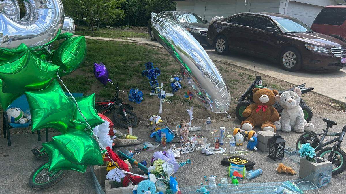 A memorial sits on the 3100 block of Greeley Avenue, where Sir’Antonio Brown was shot and killed.