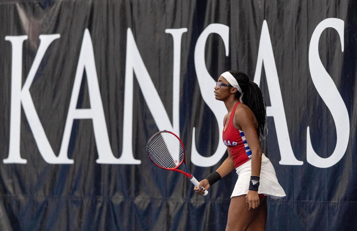 Malkia Ngounoue walks to the baseline during a doubles match against St. Mary’s on Sunday, Feb. 26, 2023, in Lawrence, Kan.