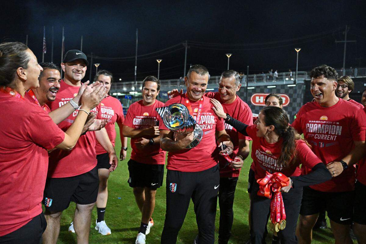 Kansas City Current coach Vlatko Andonovski celebrates with the team after their win against NJ/NY Gotham FC in Friday night’s Summer Cup championship final at Toyota Field in San Antonio.