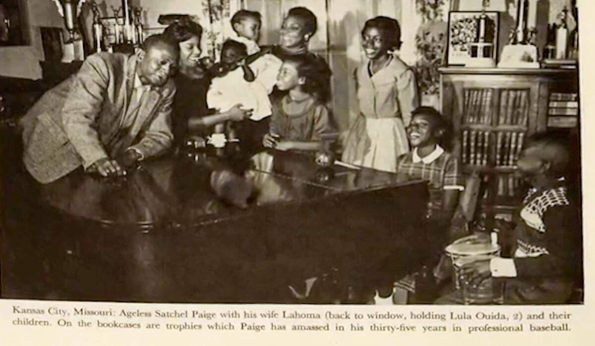 An undated news clipping shows Satchel Paige at home in Kansas City’s Santa Fe neighborhood with his wife, Lahoma, and their children.
