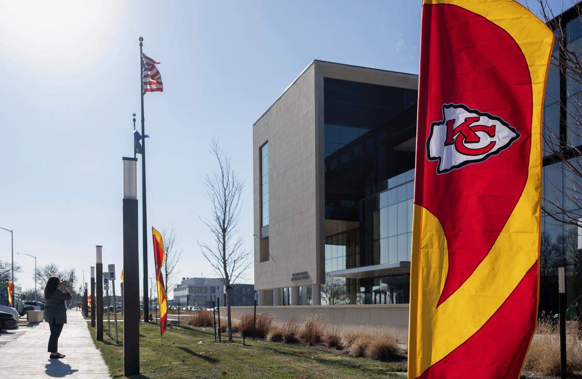 Ahead of an announcement by Gov. Laura Kelly, flags of the Kansas City Chiefs fly outside of the Docking building in Topeka, Kansas, on Monday, Dec. 5, 2025. 
