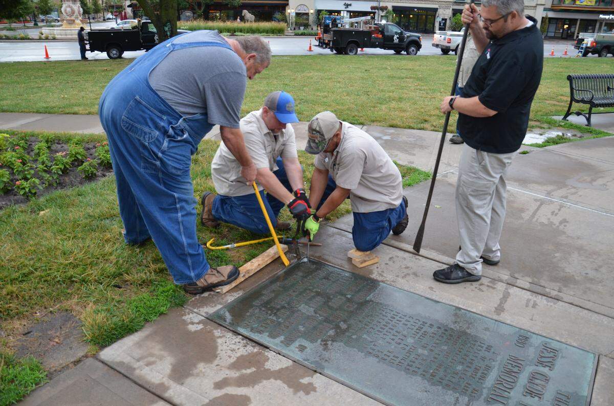 Kansas City Parks and Recreation crews removed the J.C. Nichols plaque from in front of the fountain, one day after a unanimous decision by the parks board. The fountain will eventually be renamed.