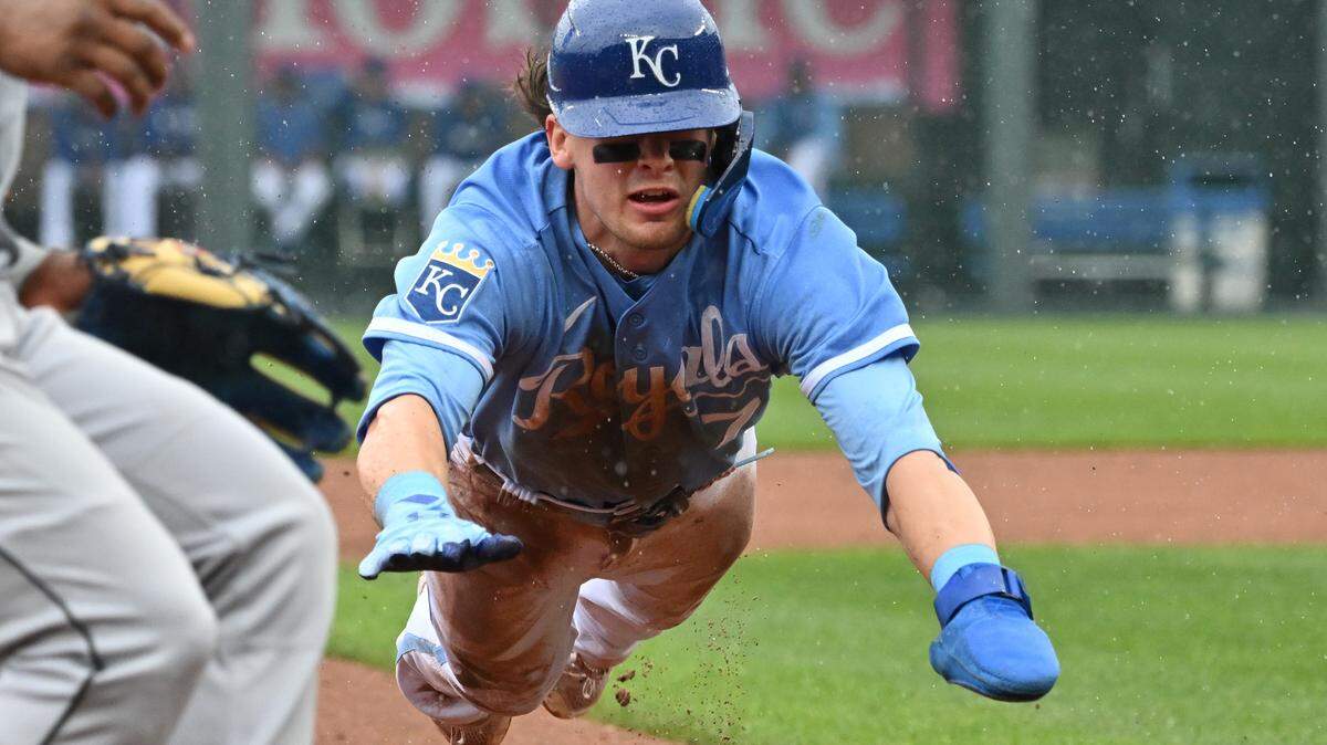 Kansas City Royals shortstop Bobby Witt Jr. dives into third for a stolen base during the first inning against the Chicago White Sox at Kauffman Stadium.