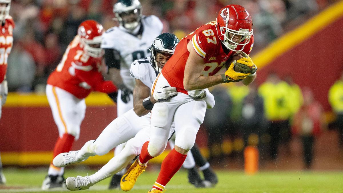 Kansas City Chiefs tight end Travis Kelce (87) runs with the ball and drags Philadelphia Eagles safety Kevin Byard (31) during an NFL football game on Monday, Nov. 20, 2023, at GEHA Field at Arrowhead Stadium in Kansas City.