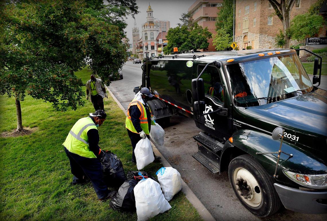 Cleaning crews were busy the morning of June 1 on the Country Club Plaza, removing graffiti from buildings and picking up trash after a weekend of protests over the death of George Floyd. A crew from Kansas City Parks & Recreation, above, loaded bags into a garbage truck at Mill Creek Park. Amid furlough discussions on Aug. 12, the city’s head of solid waste, Michael Shaw, said it was “unconscionable” to furlough trash and recycling collectors and other lower-wage city workers.