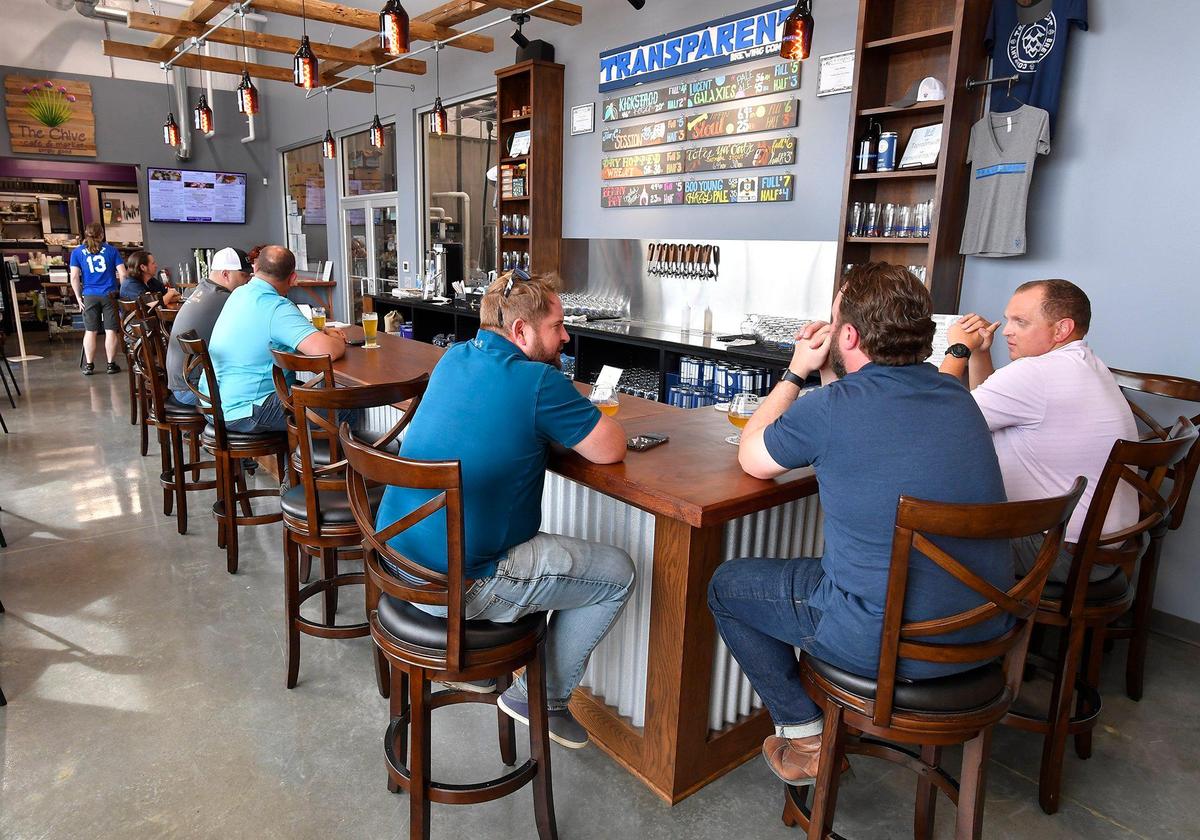 With vaccinations and the easing of mask mandates, restaurants are seeing more business. Michelle Brown opened The Chive Simply Good Cafe and Market in August, and her son Nolan Brown opened his brewery, Transparent Brewing Co., in the same Grandview building. Customers enjoyed drinks at the bar recently.