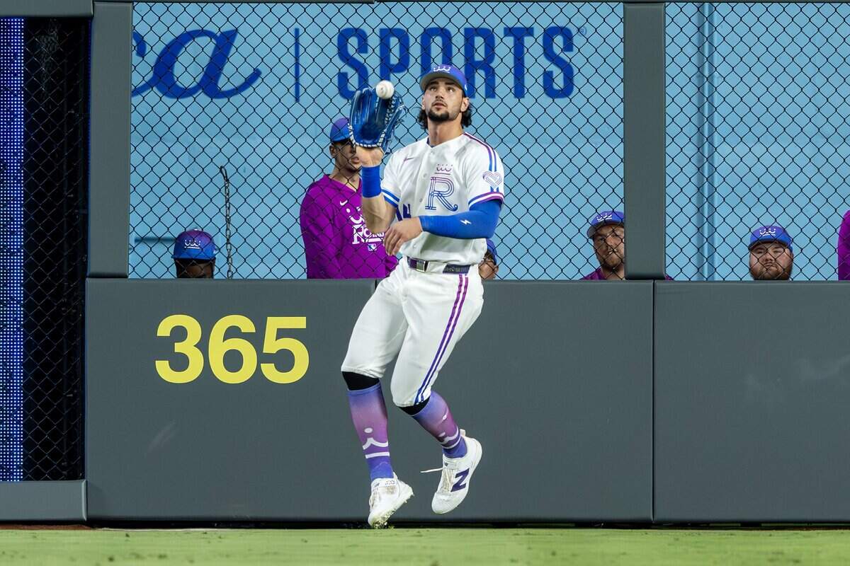 Wearing the Kansas City Royals' new "Forever Fountains" City Connect uniform, right fielder Jac Caglianone (14) catches a fly ball in the ninth inning against the Houston Astros on Friday, June 12, 2026, at Kauffman Stadium in Kansas City.