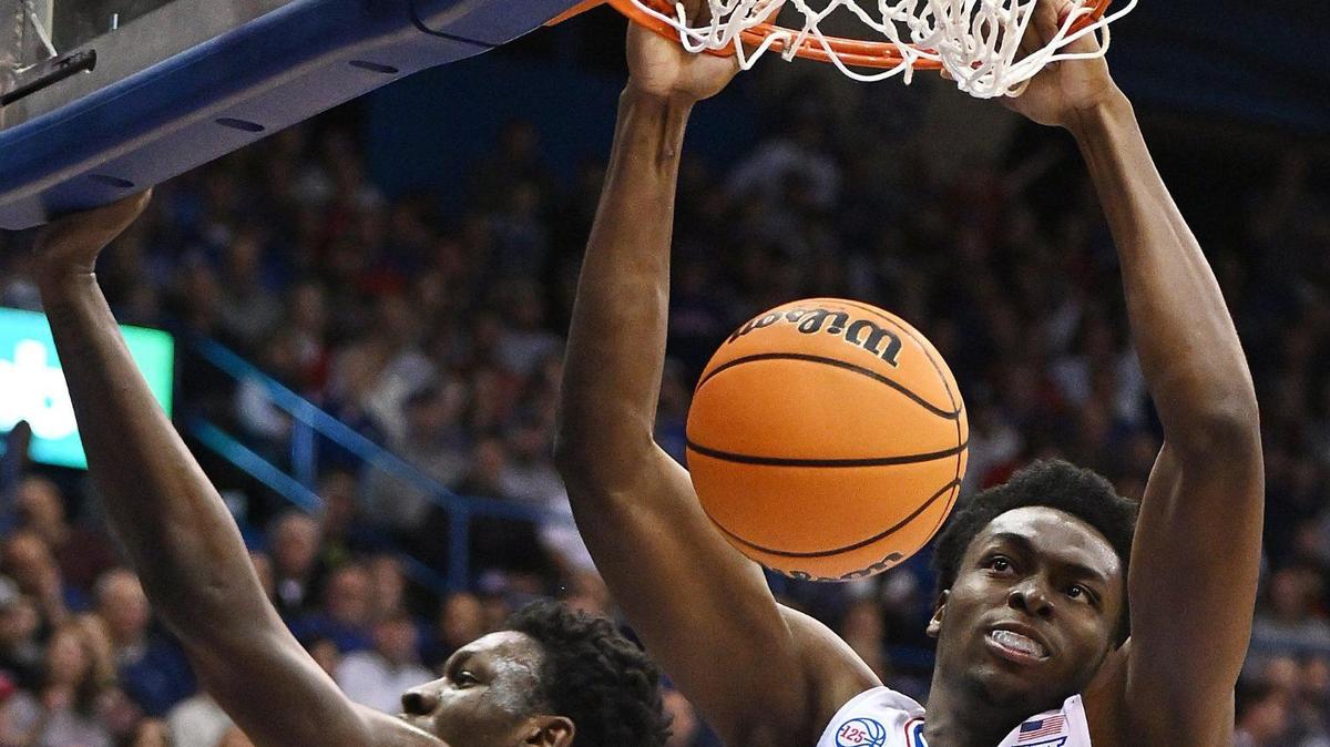 KU’s Ernest Udeh dunks over Seton Hall’s Tyrese Samuel during the first half of Thursday night’s game at Allen Fieldhouse.