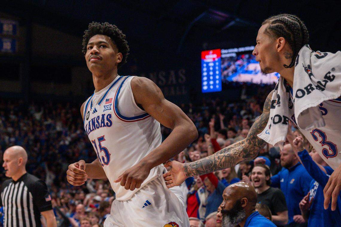 Kansas Jayhawks forward Bryson Tiller (15) smiles as guard Tre White (3) celebrates a made shot in the second half vs. the Houston Cougars on Monday, February 23, 2026, at Allen Fieldhouse.
