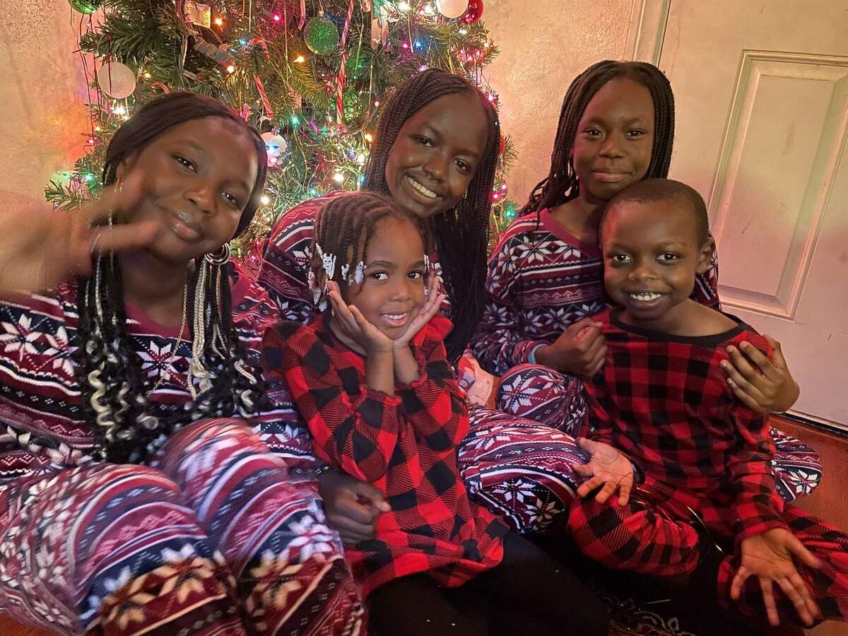 A Christmas portrait of Jackson Georgani, far right, and his sisters, from left, Ayon, Evilin, Atong and Anjeza.