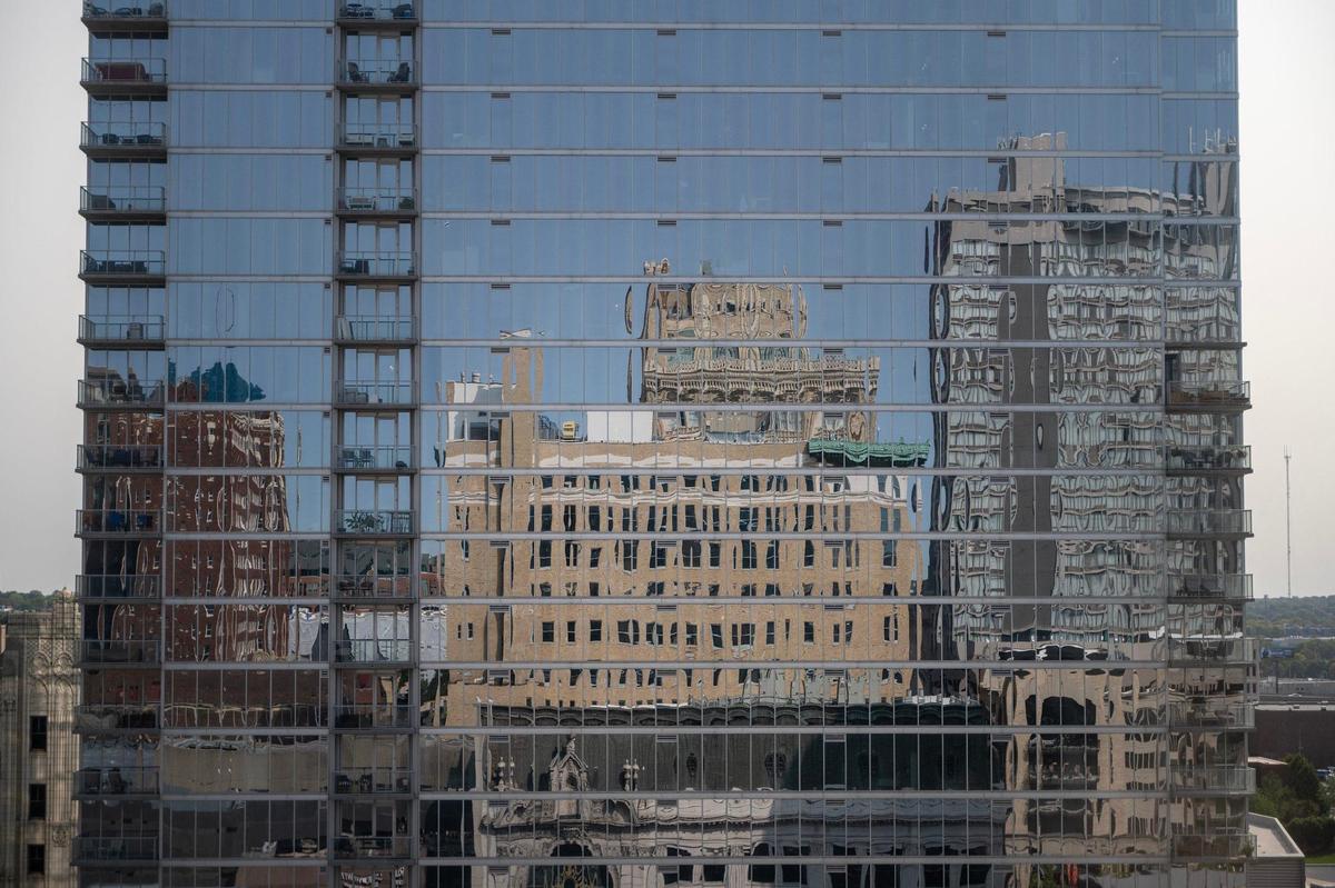 The Midland Lofts are reflected in the windows of One Light apartments on Thursday.