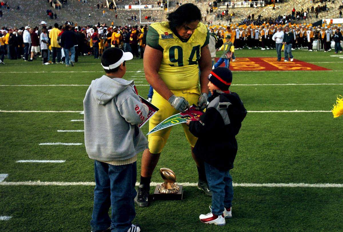 When the University Oregon competed in the 2003 Sun Bowl, Junior signed autographs after being awarded the defensive player of the game.