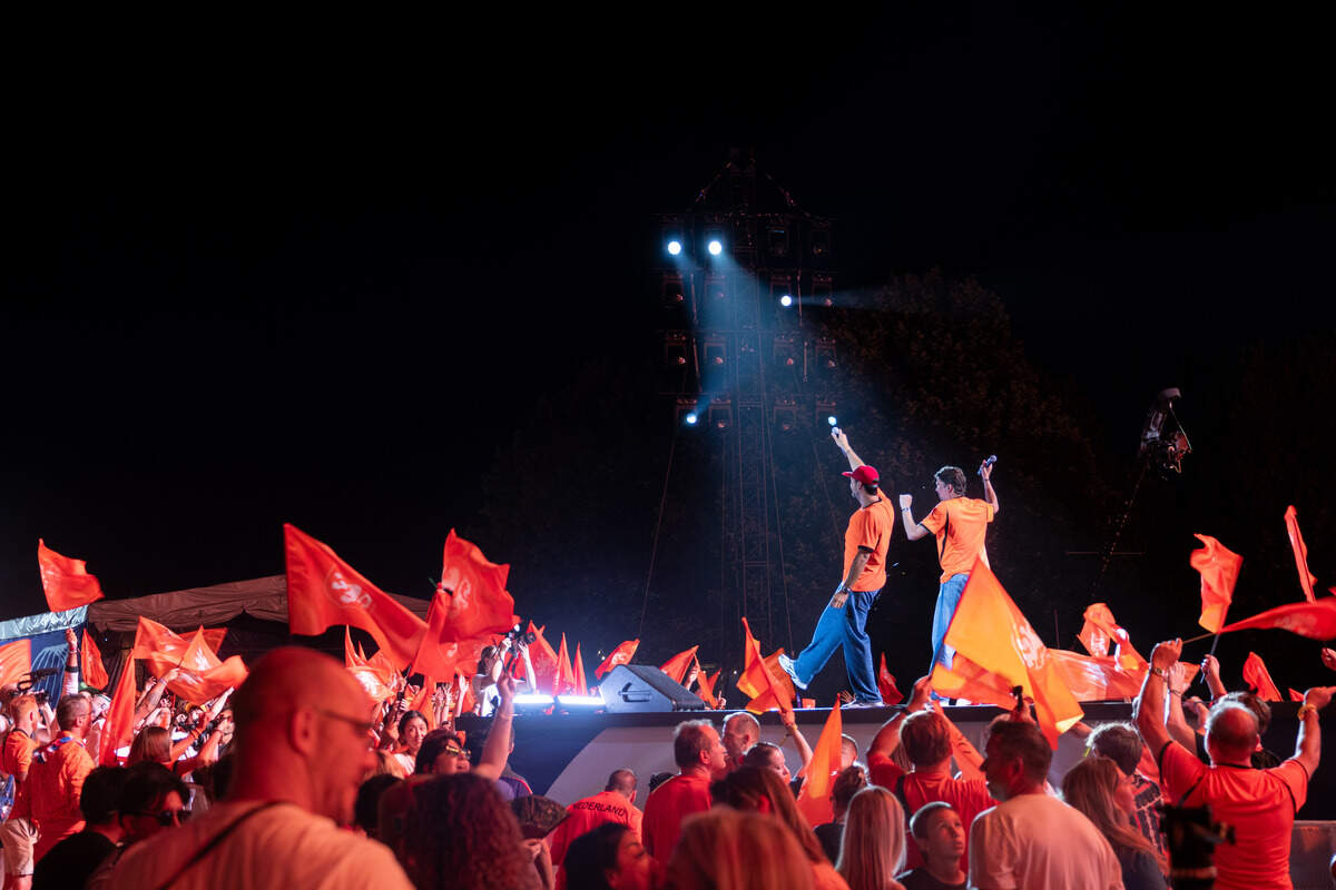 Dutch fans wave their flags and cheer as they celebrate their team during the Bij Oranje Party at Fan Fest on Wednesday, June 24, 2026.