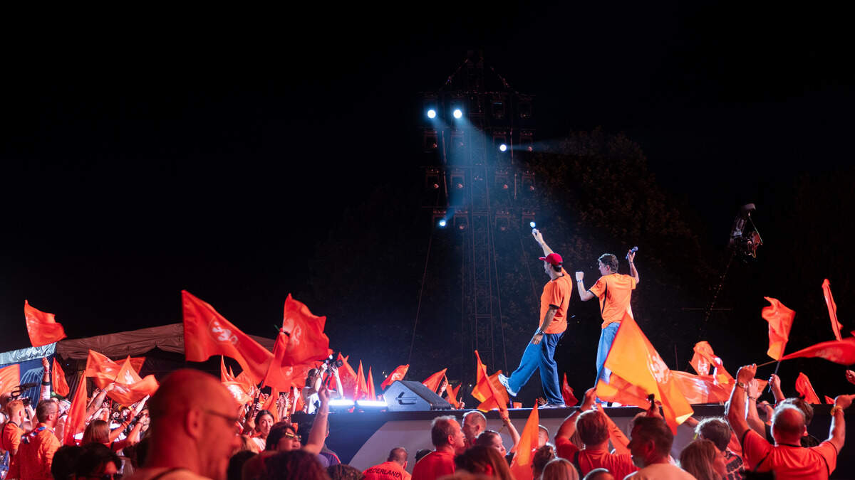 Dutch fans wave their flags and cheer as they celebrate their team during the Bij Oranje Party at Fan Fest on Wednesday, June 24, 2026.