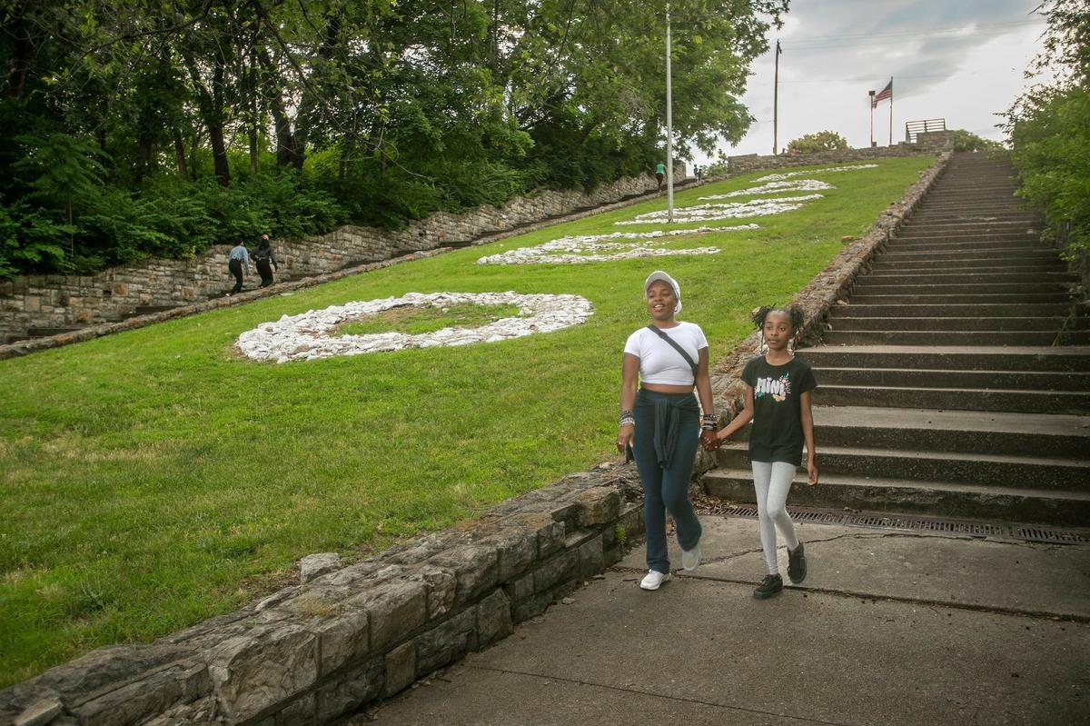 The Paseo Stairs in front of the Paseo Academy of Fine and Performing Arts is a popular local spot for walkers and runners. Porchea Martin and her 11-year-old daughter Harmony Martin walked the stairs together on June 16.