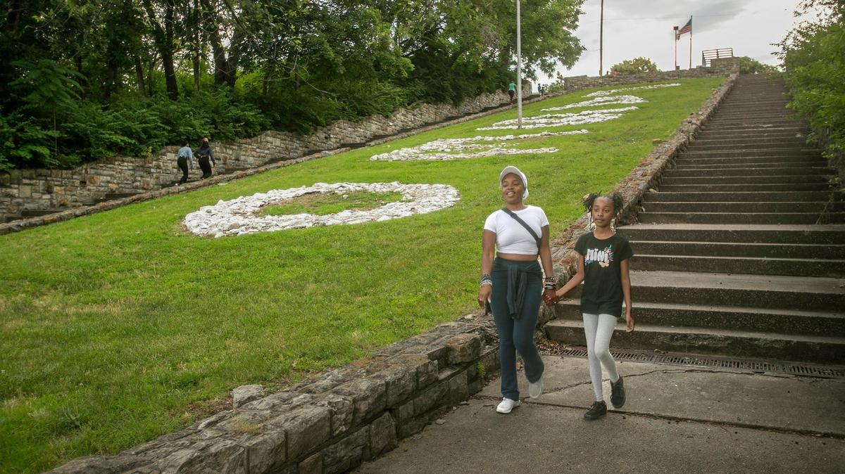 The Paseo Stairs in front of the Paseo Academy of Fine and Performing Arts is a popular local spot for walkers and runners. Porchea Martin and her 11-year-old daughter Harmony Martin walked the stairs together on June 16.
