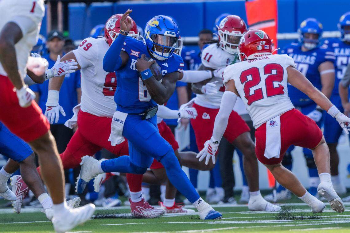 Kansas Jayhawks quarterback Jalon Daniels (6) makes a move in the open field in the first half of the Jayhawks game vs. the Fresno State Bulldogs on Saturday, Aug. 23, 2025, at David Booth Kansas Memorial Stadium, in Lawrence.