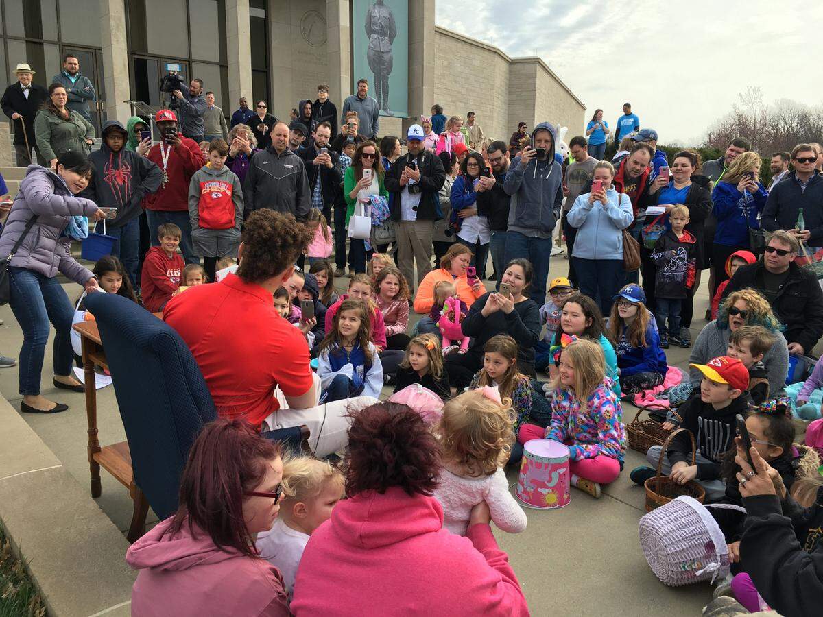 Kansas City Chiefs quarterback Patrick Mahomes reading to children participating in the Easter fun at the 2018 Harry’s Hop ’n Hunt