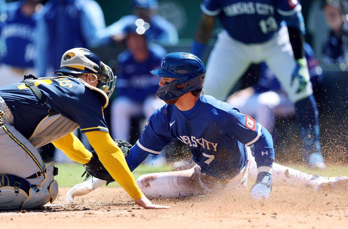 Shortstop Bobby Witt Jr. #7 of the Kansas City Royals is tagged out at home plate by catcher William Contreras #24 of the Milwaukee Brewers during the 3rd inning of the game at Kauffman Stadium on April 5, 2026 in Kansas City.