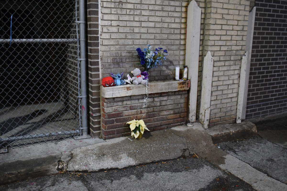 A memorial was set up for Grayson O’Connor, 5, who was found dead in an alley behind the Grand Boulevard Lofts at 1006 Grand Boulevard in downtown Kansas City on Monday. Police say the boy fell from a window and are investigating as possibilities that he was killed or died as a result of child endangerment.