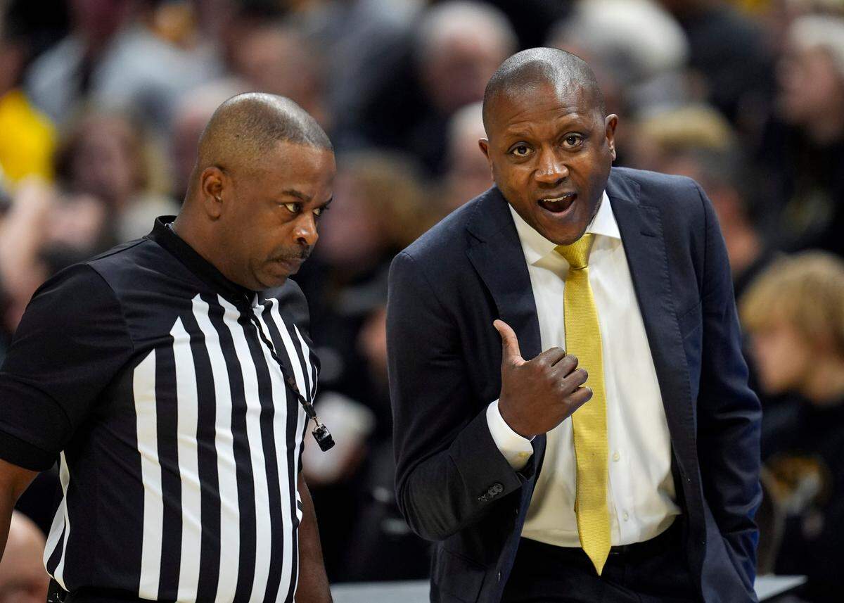 Missouri Tigers basketball coach Dennis Gates talks with an official during the game against the Kansas Jayhawks on Sunday, Dec 8, 2024 at Mizzou Arena in Columbia, Missouri.