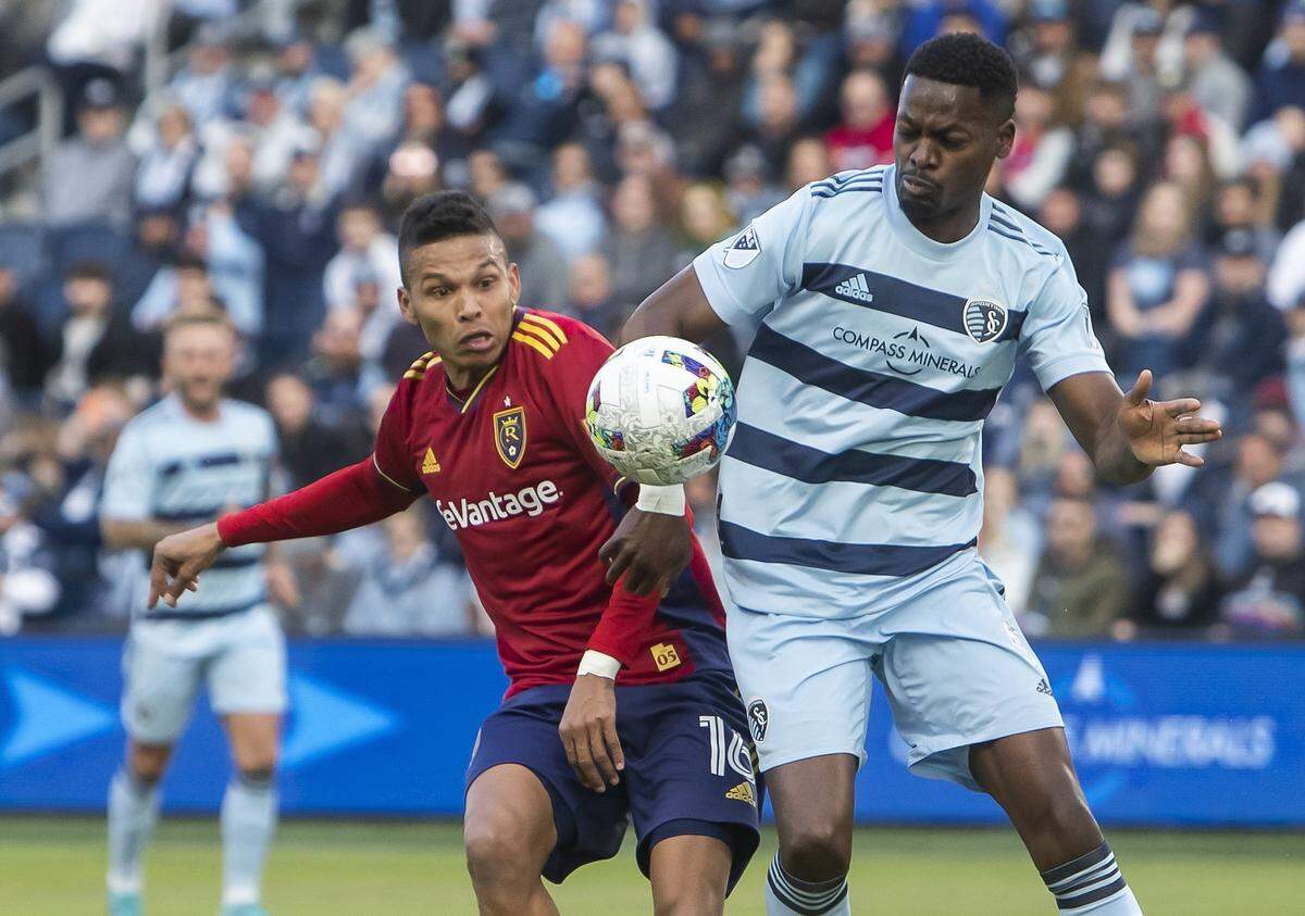 Sporting Kansas City defender Nicolas Isimat-Mirin, right, fights for possession of the ball against Real Salt Lake midfielder Maikel Chang during a match in late March at Children’s Mercy Park in KCK.