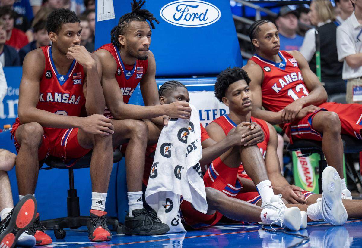 Darryn Peterson and his Kansas Jayhawks teammates listen to speeches on Senior Day at Allen Fieldhouse on Saturday, March 7, 2026, in Lawrence, Kansas.