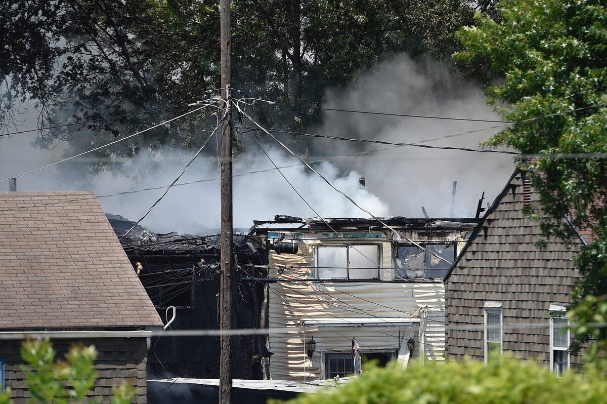 Smoke billowed into the air above an apartment complex in Kansas City, Kan., Saturday.