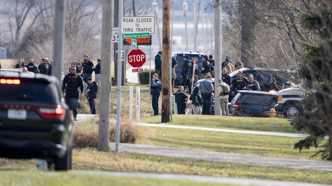 Law enforcement and medical personnel work the scene of an officer-involved shooting near Elsea Smith and Bundschu roads in Independence on Thursday.