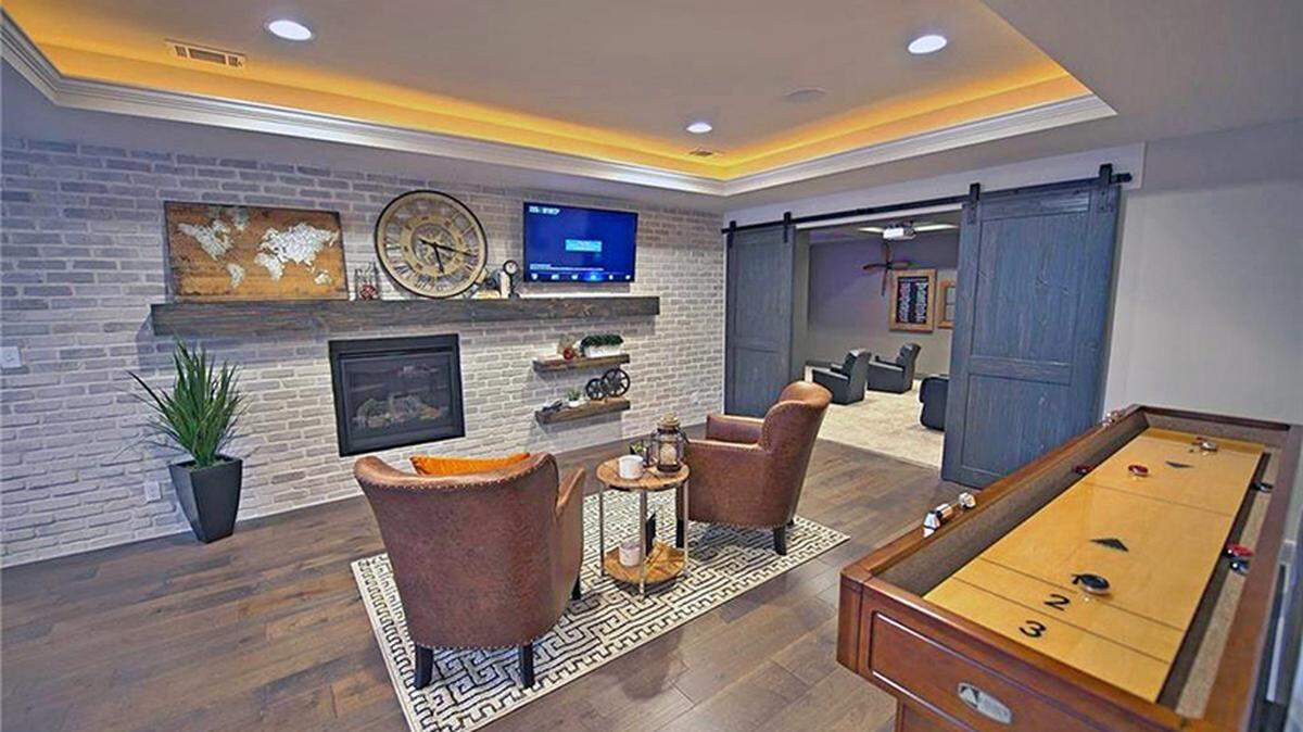 James Engle Custom Homes’ Emery II in Rodrock’s Stonebridge Park is move-in ready and tempts buyers with an incredible finished basement, including a professional home theater, bar, and large gaming area with a fireplace. And James Engle is offering an astounding $10,000 gift card to Nebraska Furniture Mart for a signed contract by May 31st!