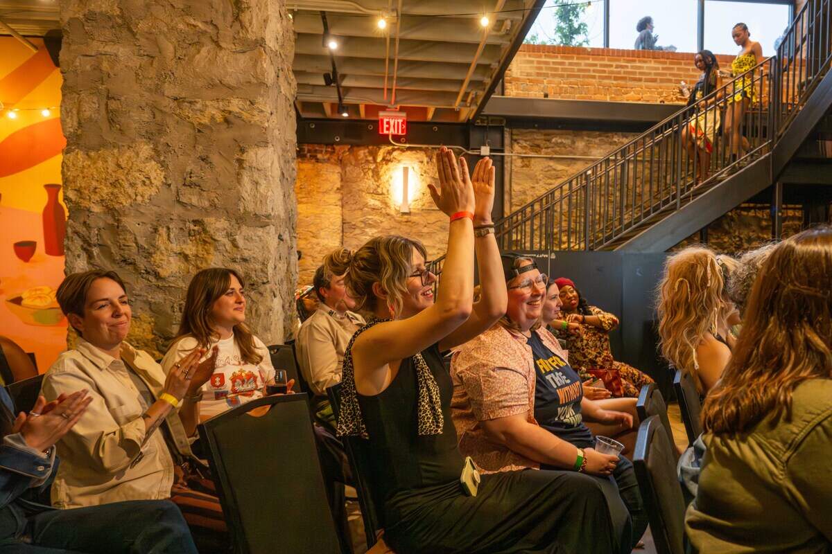 The crowd cheers after a presentation at “Where To Find Us”, an event that invites friends to ‘pitch’ their friends to potential romantic and platonic partners in front of an audience.