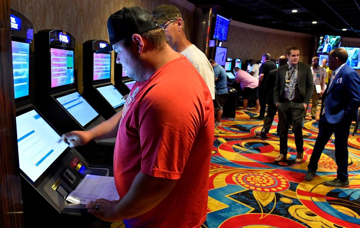 Legalized sports betting got underway Thursday in Kansas, including a location at the Hollywood Casino at Kansas Speedway, in Kansas City, Kansas. Preston Evertt, of Atchison, was one of the first to try out one of the kiosks. He was putting down several bets on NFL games and professional golf. The temporary Barstool Sportsbook consists of 30 sports betting kiosks and five betting windows with odds boards and 45 high-definition televisions. The casino plans on opening a permanent Barstool Sportsbook in the fall.