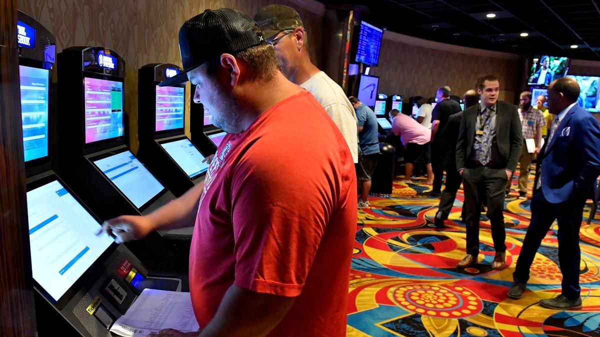 Legalized sports betting got underway Thursday in Kansas, including a location at the Hollywood Casino at Kansas Speedway, in Kansas City, Kansas. Preston Evertt, of Atchison, was one of the first to try out one of the kiosks. He was putting down several bets on NFL games and professional golf. The temporary Barstool Sportsbook consists of 30 sports betting kiosks and five betting windows with odds boards and 45 high-definition televisions. The casino plans on opening a permanent Barstool Sportsbook in the fall.
