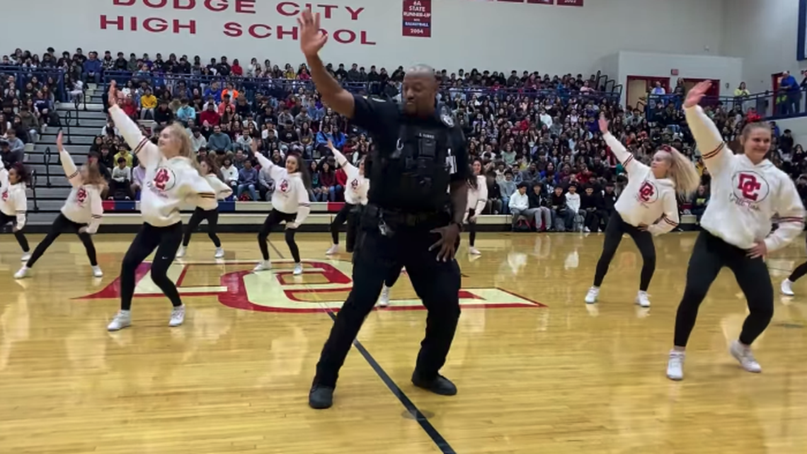 Shane Harris, the school resource officer at Dodge City High School in Kansas, joined the drill team for a performance on Thursday, Dec. 8.