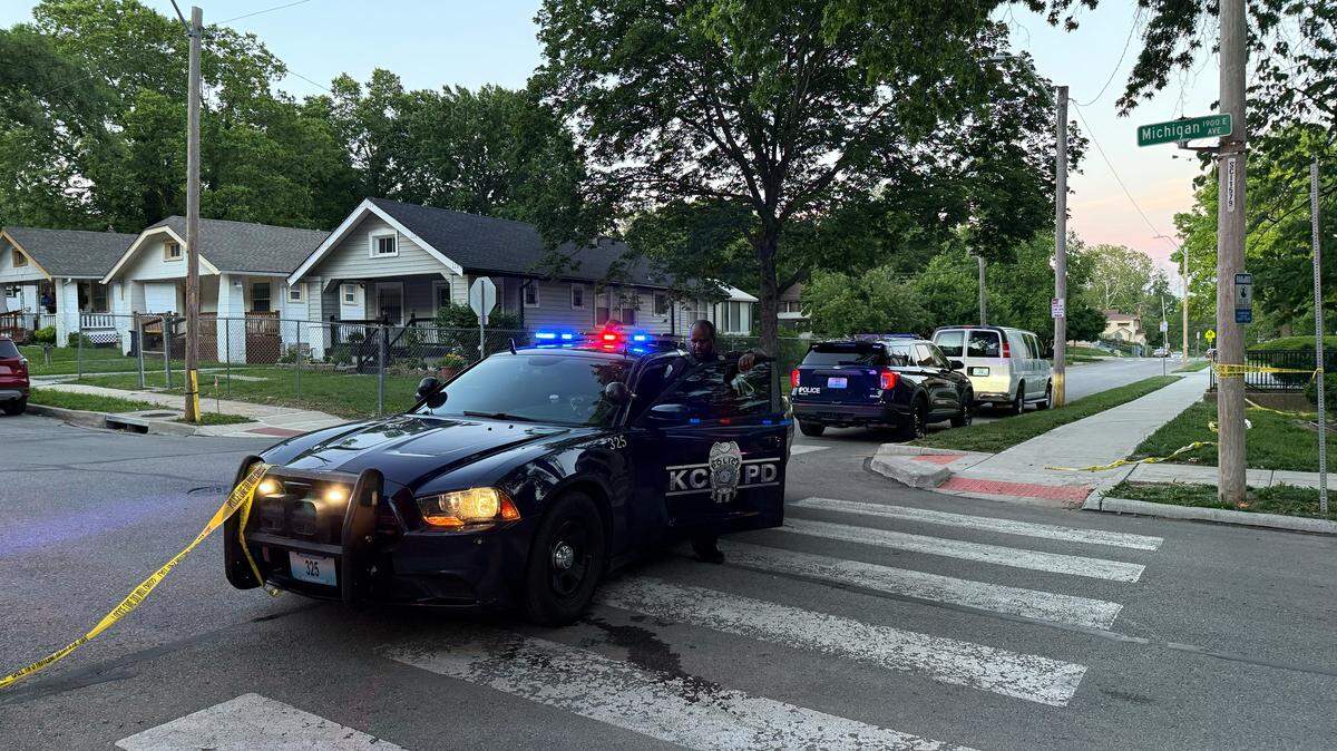 Kansas City police close off the block near 58th Street and Michigan Avenue following a deadly shooting on May 25, 2026, in Kansas City, Missouri.