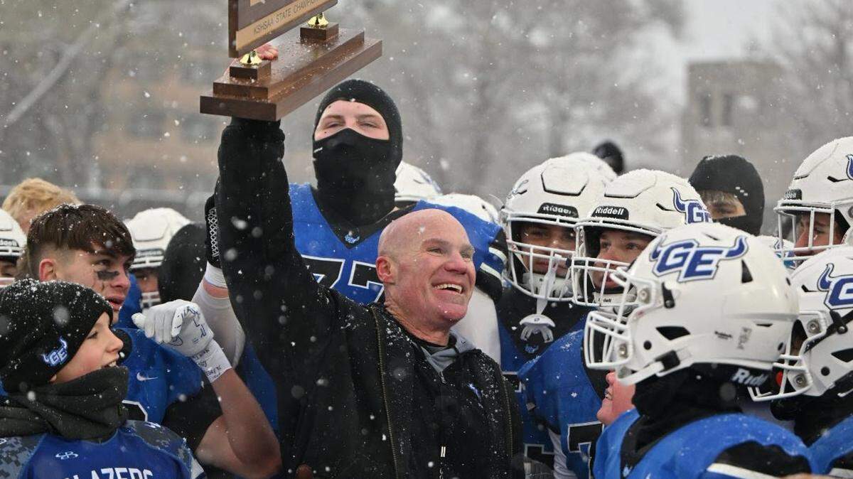 Coach Jesse Owen and his Gardner Edgerton team celebrate winning the Kansas Class 6A state championship on Saturday.