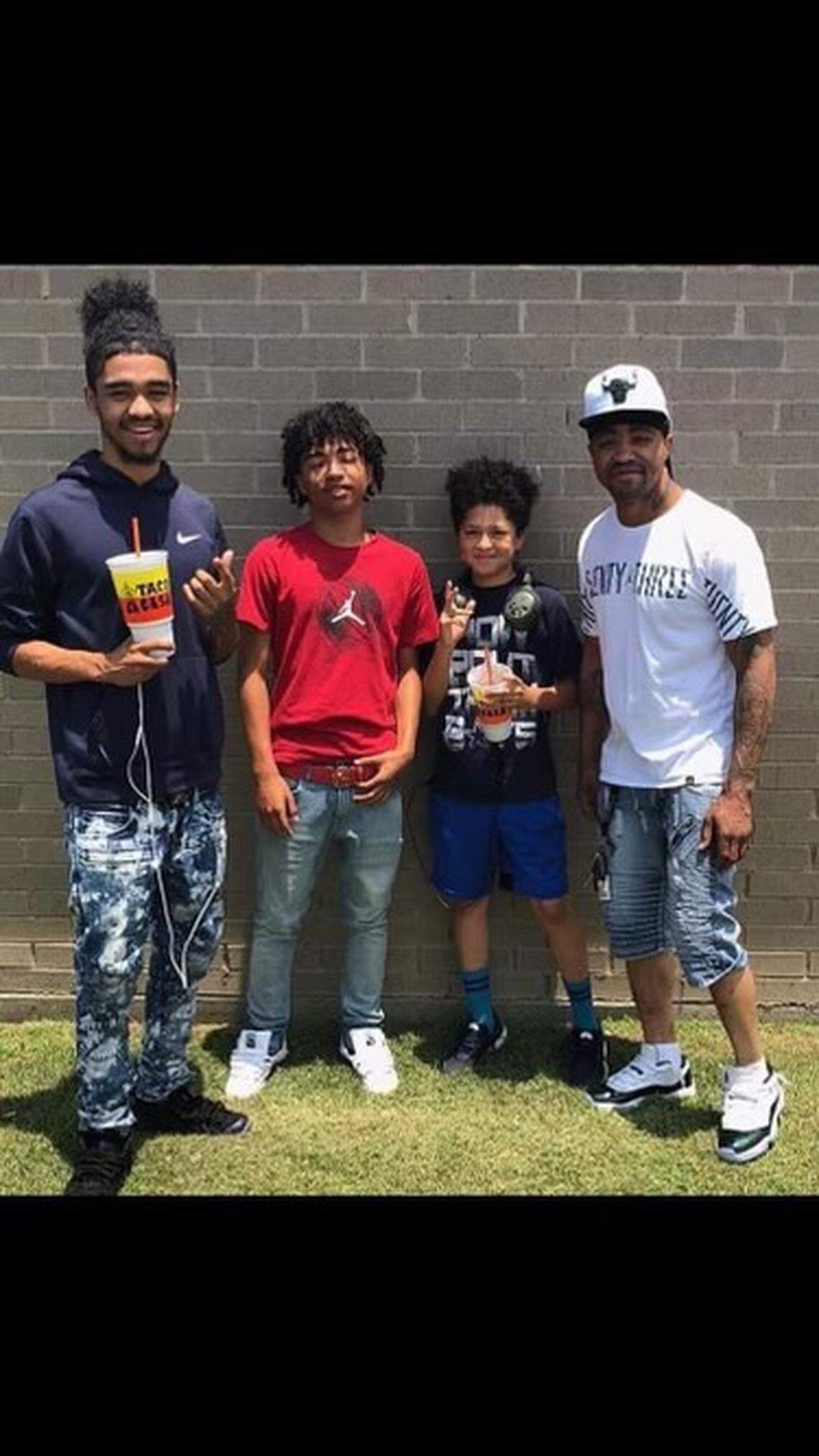 Marcell Nelson (far right) poses with some of his children. Nelson, 42, was one of the people killed in a shooting Friday in Kansas City that involved a police officer.